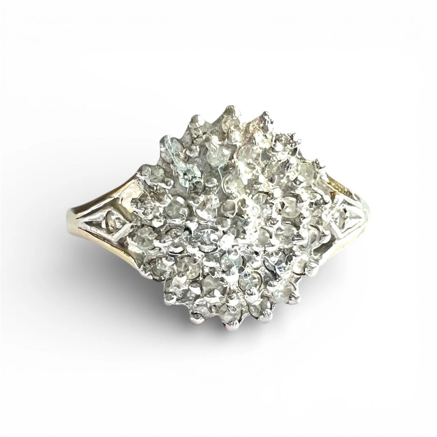 Vintage Diamond cluster ring with a white background, close up front view of setting