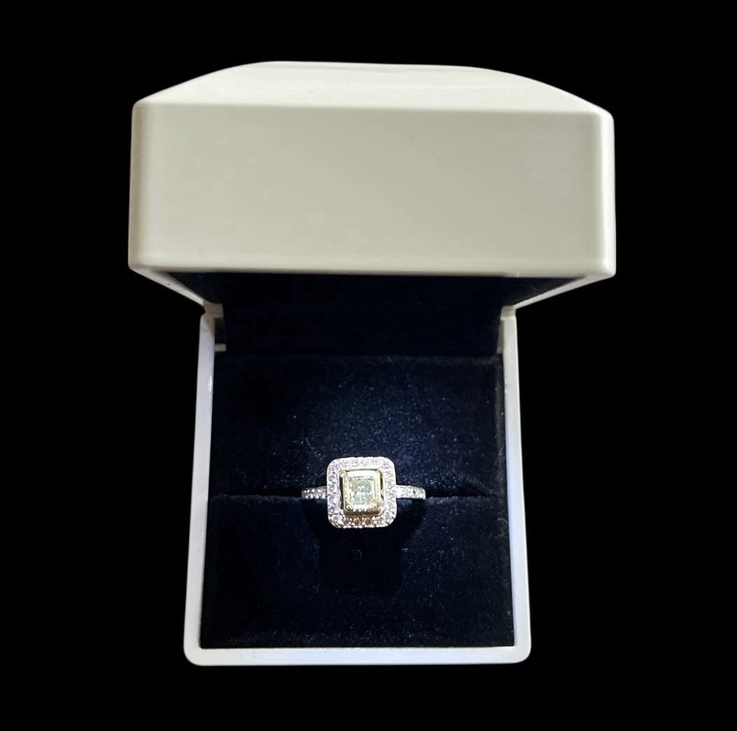 Diamond ring in a jewelry box on a black background