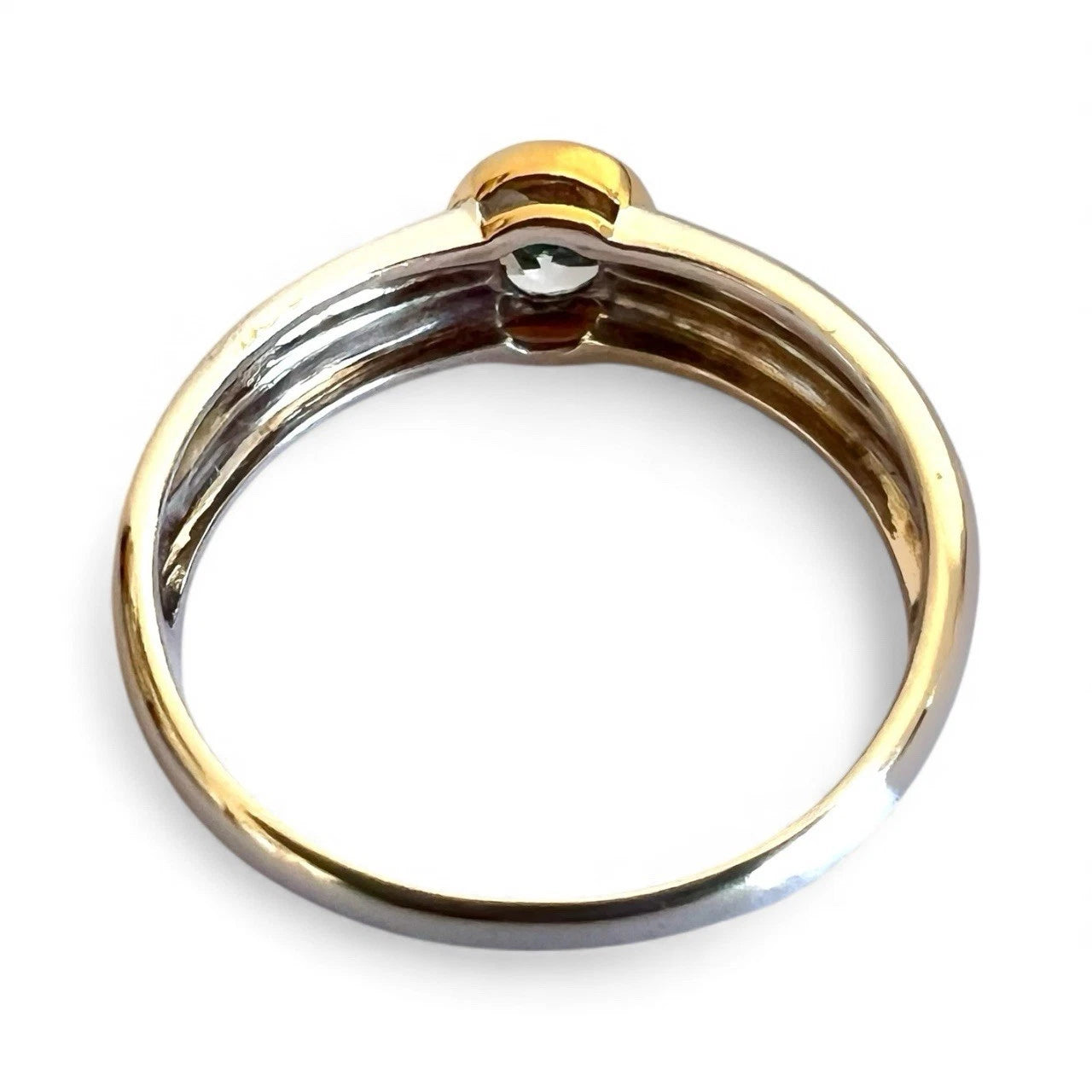 Gold and white gold ring on a white background