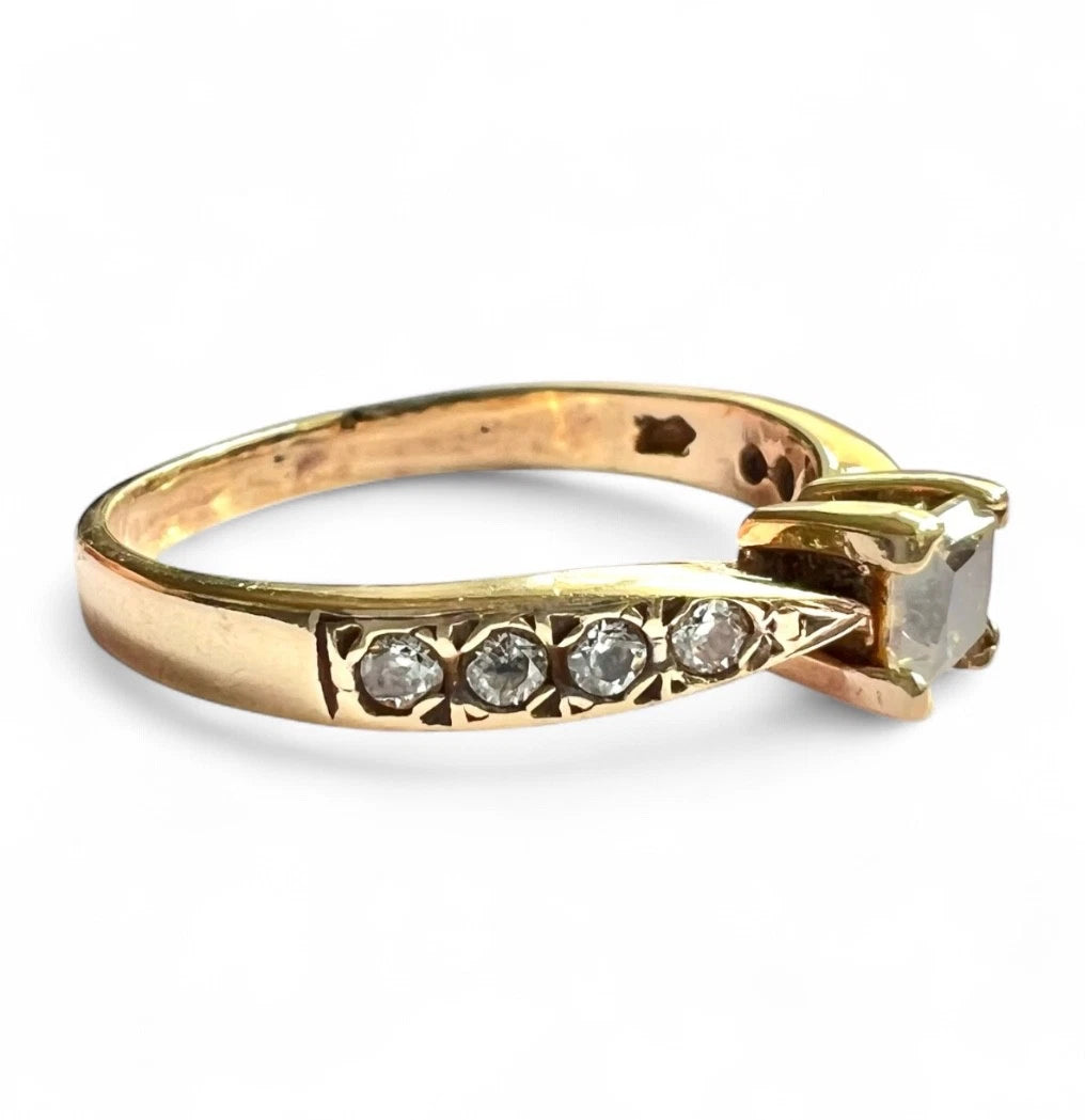 Gold ring with CZ on a white background, close up, size view 