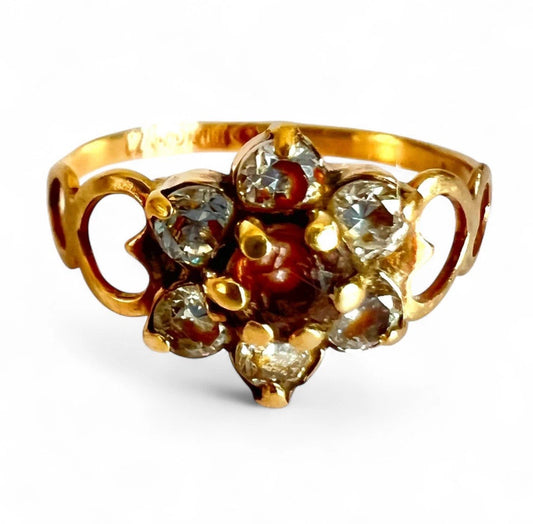 Vintage Gold ring with gemstones on a white background