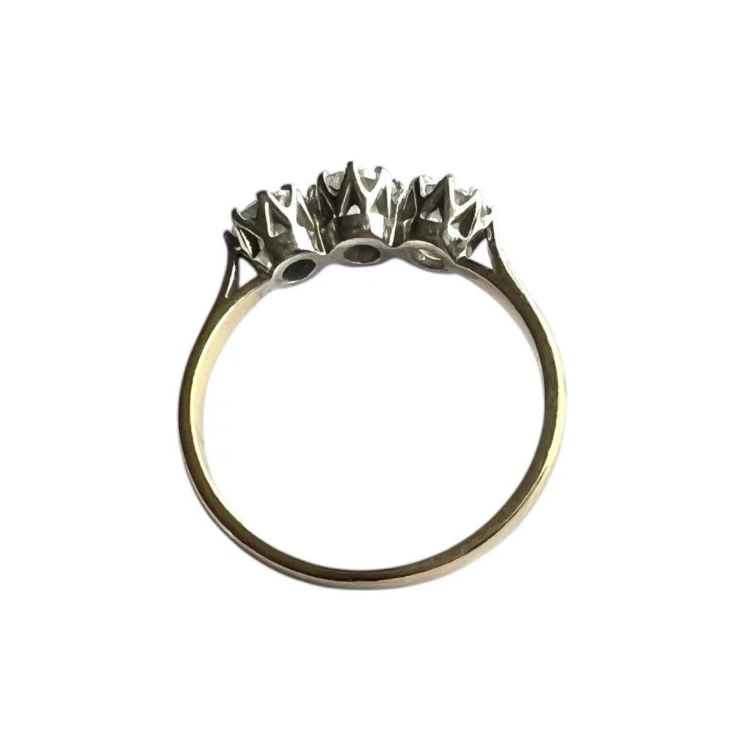 Gold ring with large cubic zircon is on a white background top down view 
