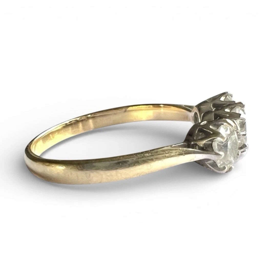 Gold ring with a cubic zirconia on a white background side view close up 