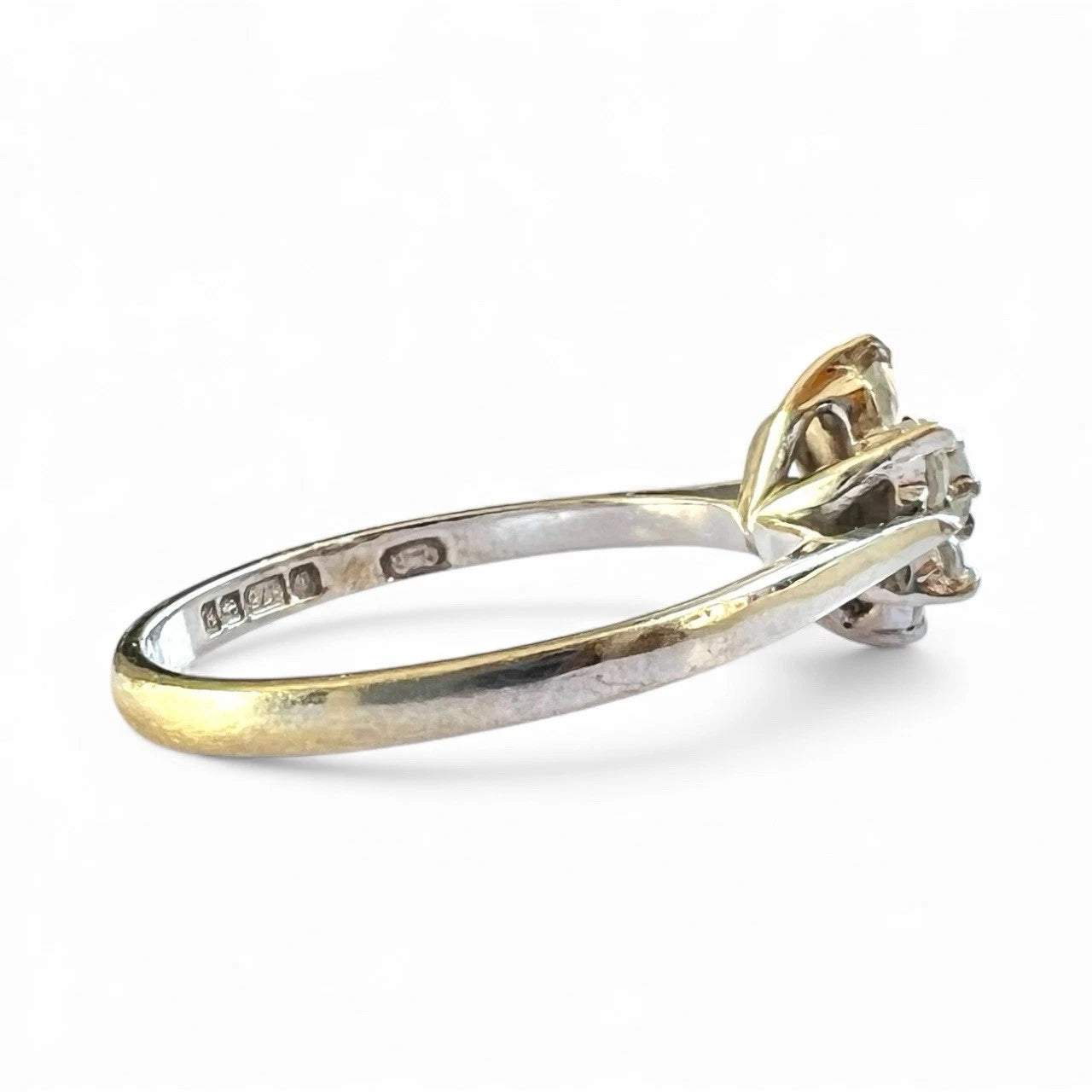 White Gold ring with cubic zirconia on a white background with visible hallmarks
