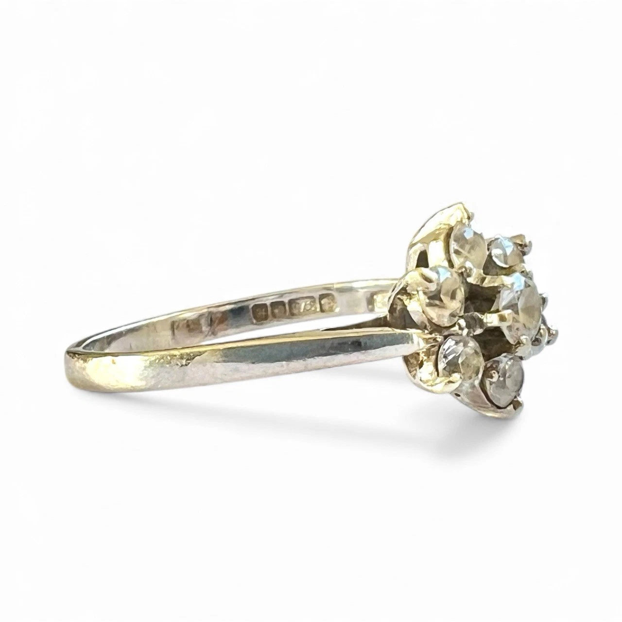 White Gold ring with gemstones on a white background