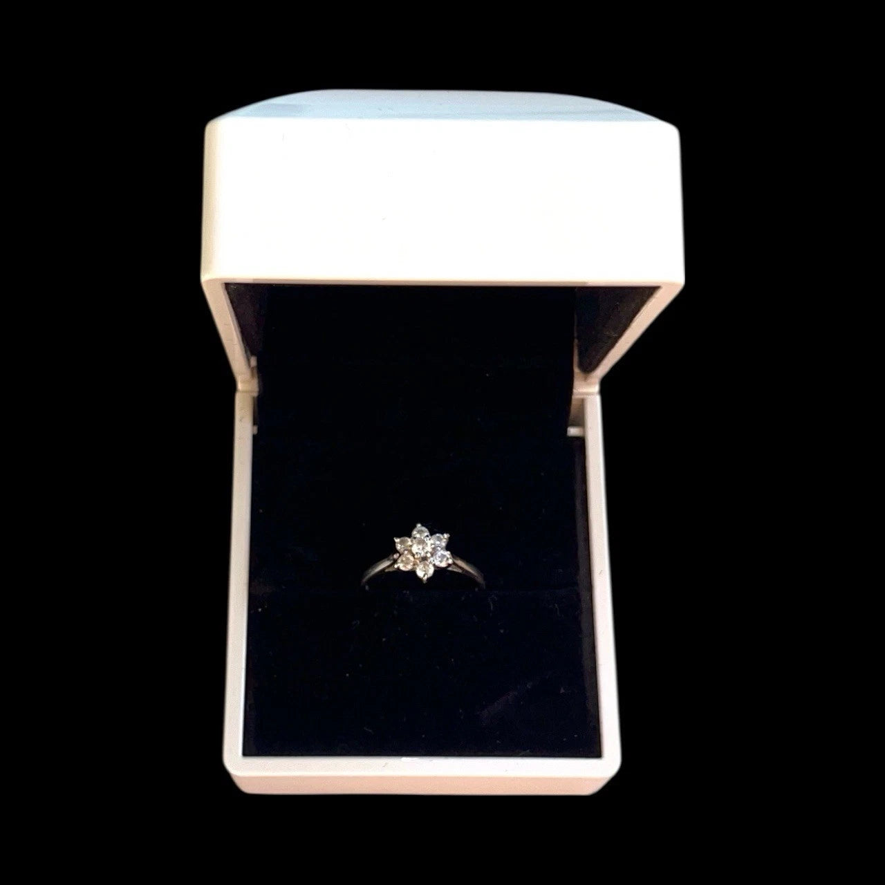 Cubic Zirconia ring in a white box on a black background
