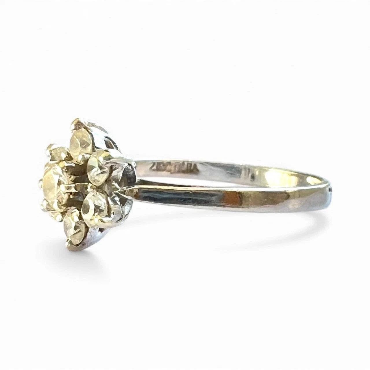 White gold ring with a cubic zirconia gemstone on a white background