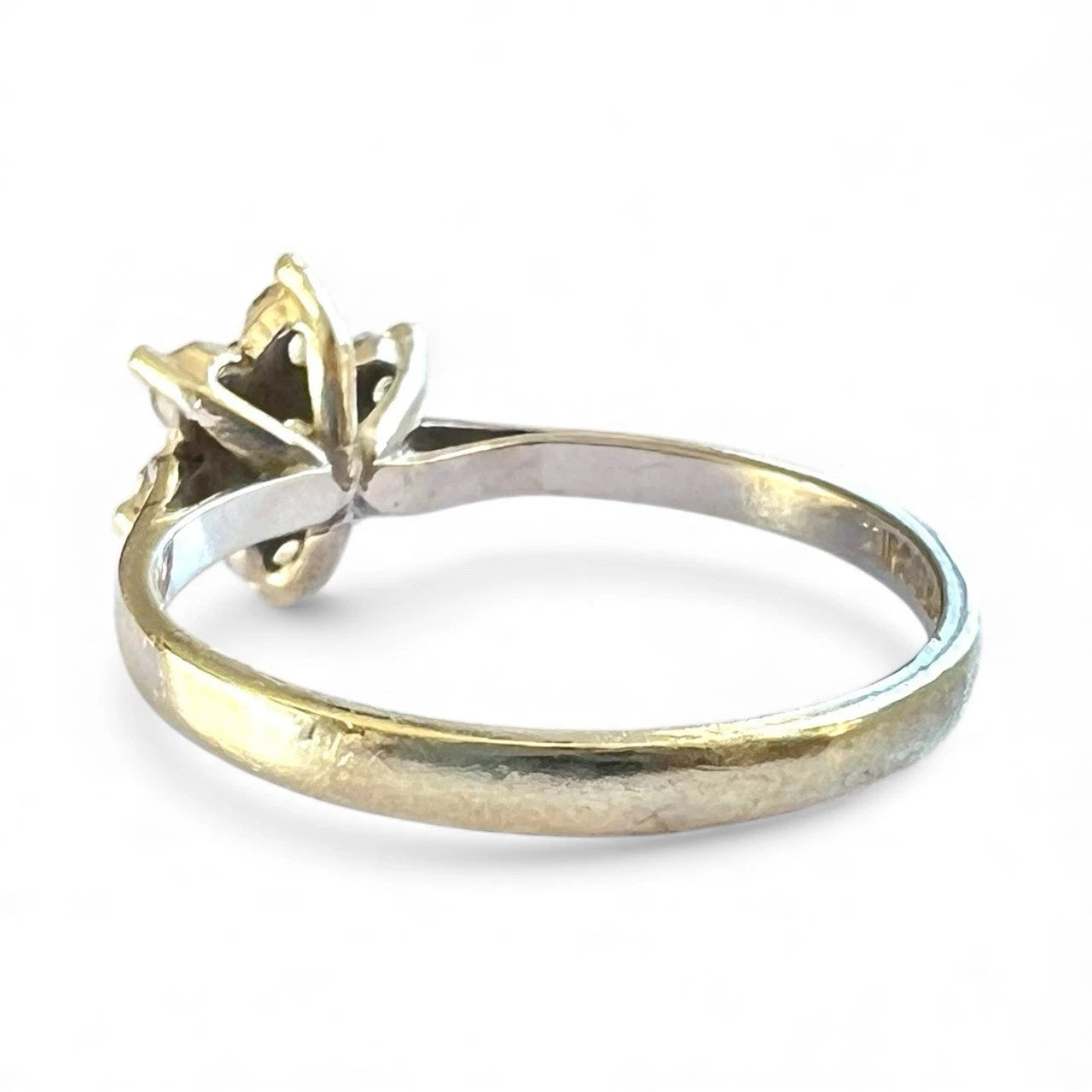 White gold cubic zirconia flower cluster ring on a white background