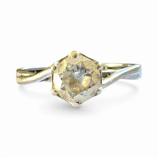 Vintage Gold ring with a large cubic zirconia on a white background, front view close up of setting 
