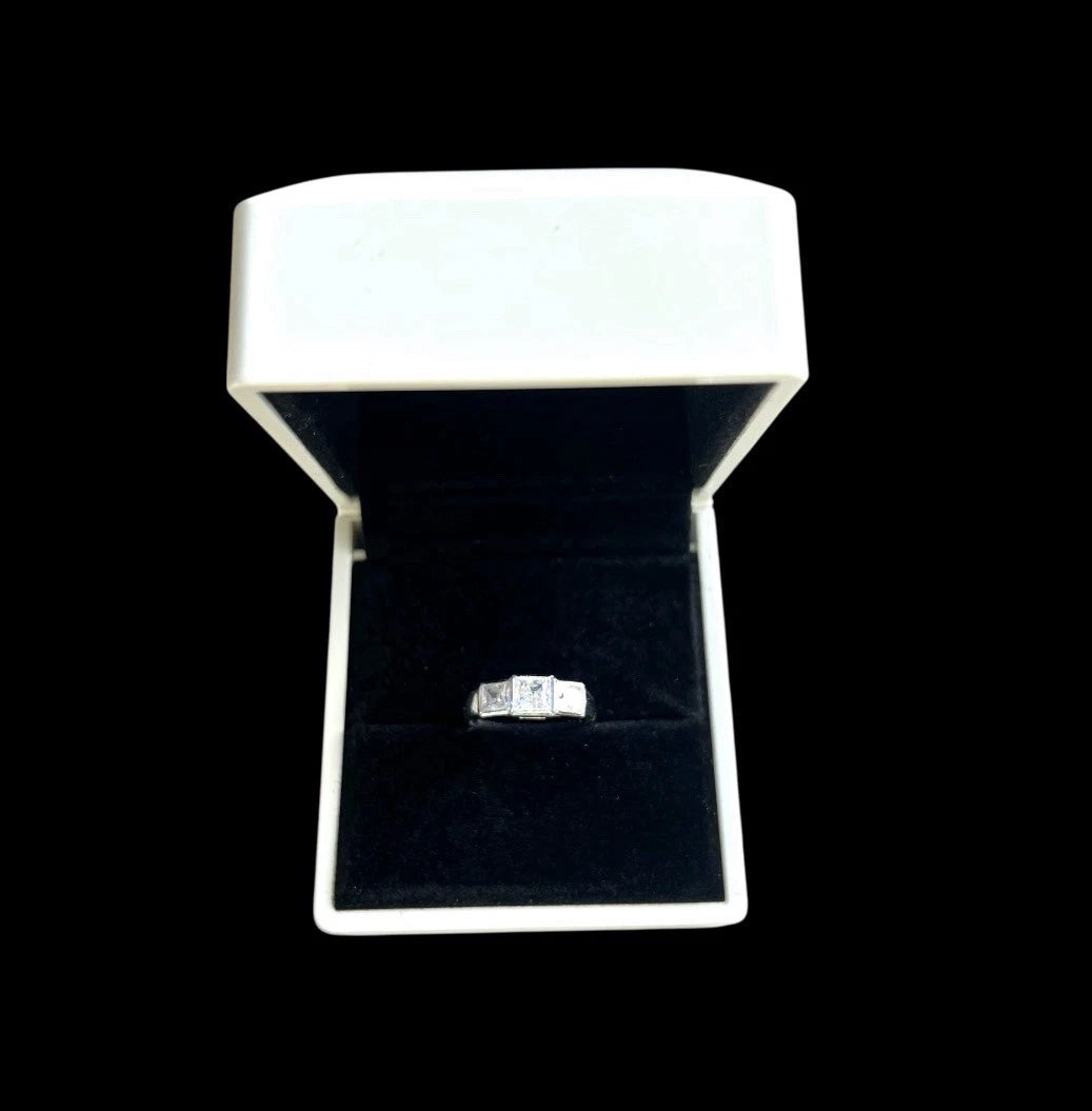 Cubic Zirconia ring in a white jewellery box on a black background