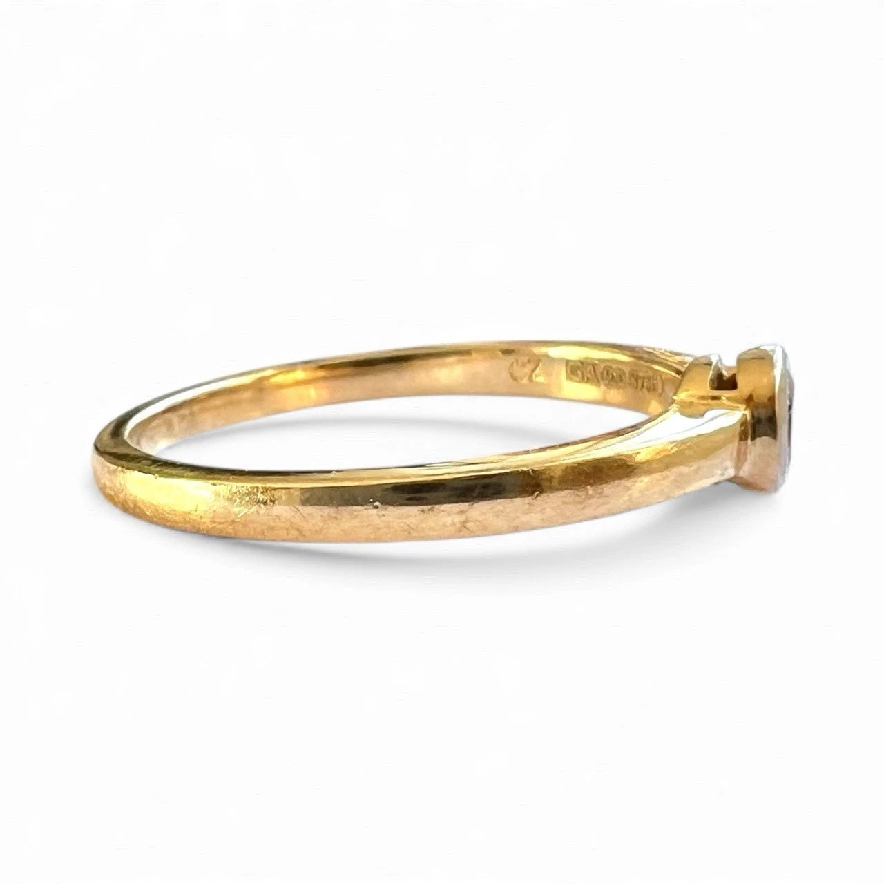 Gold ring on a white background