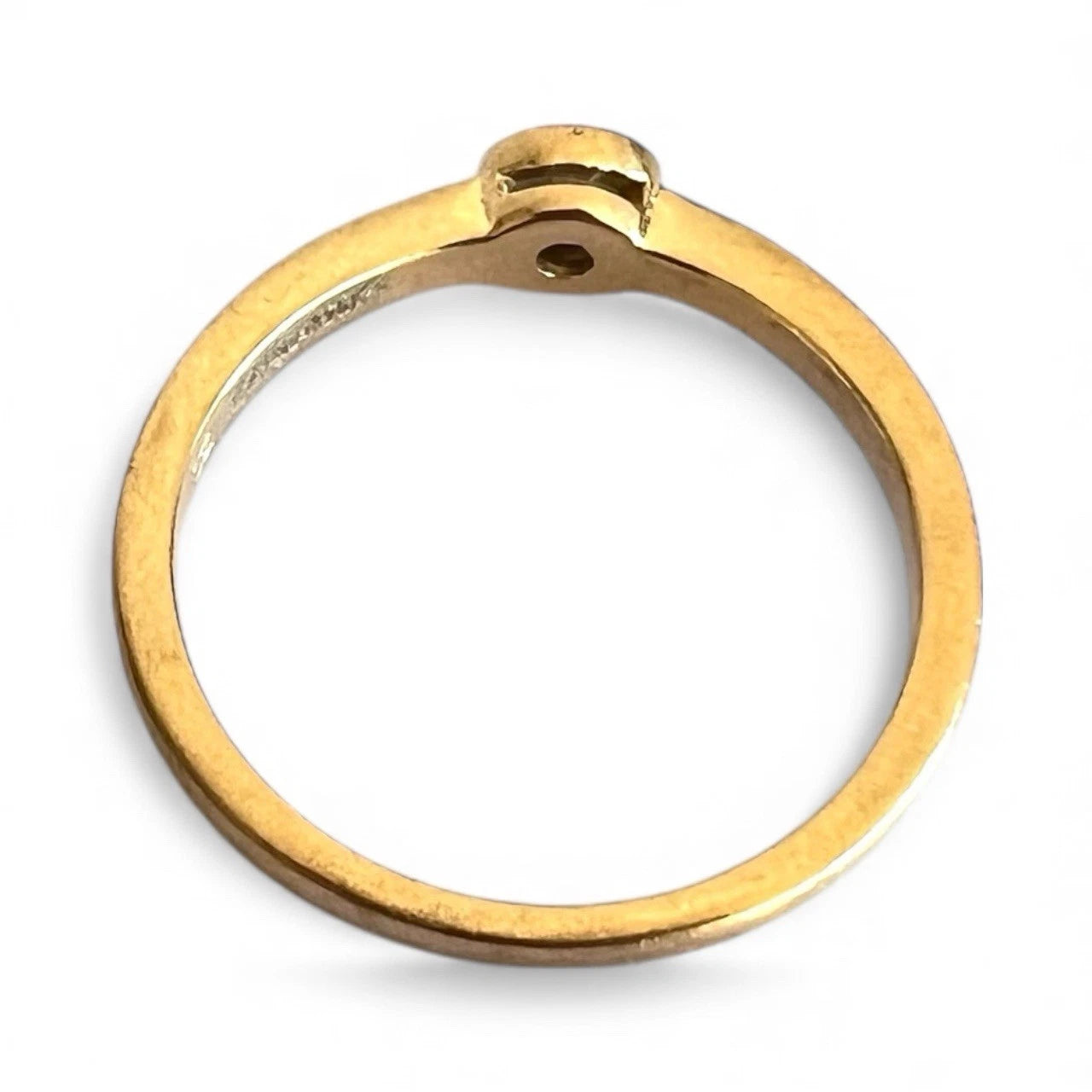 Gold ring on a white background
