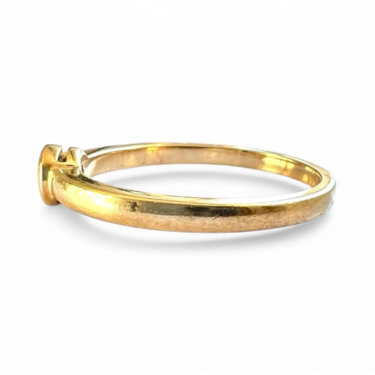 Gold ring on a white background