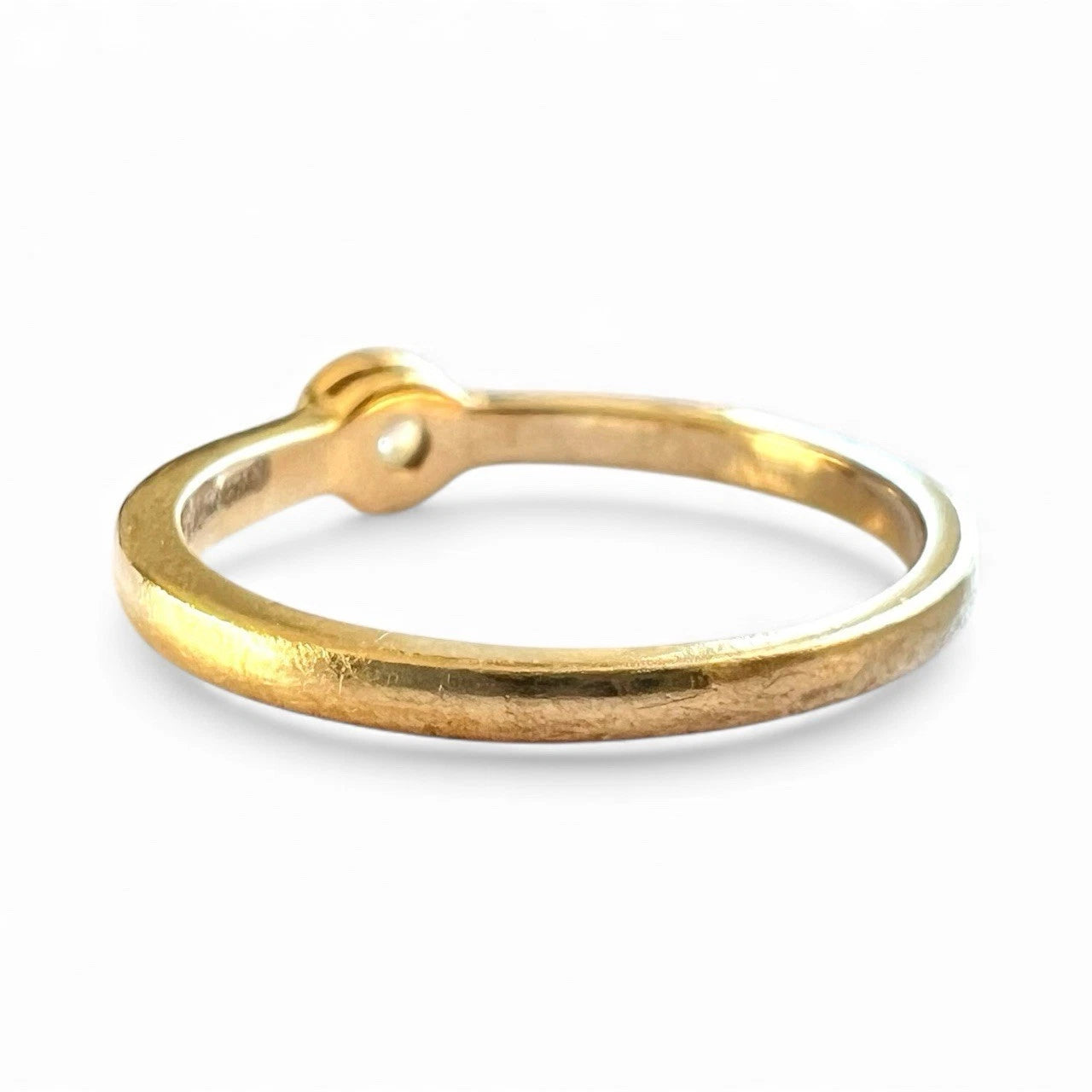 Gold ring on a white background