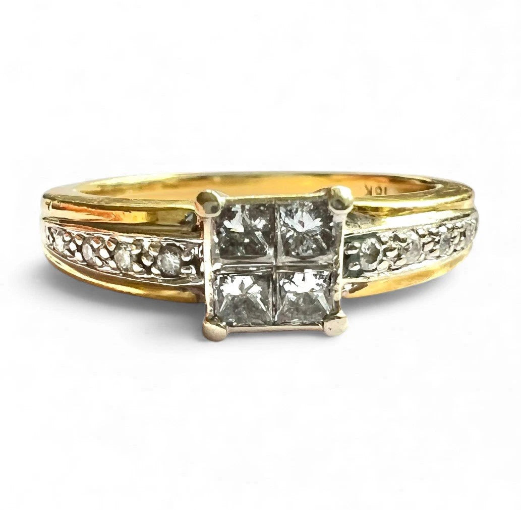 Gold ring with diamond accents on a white background