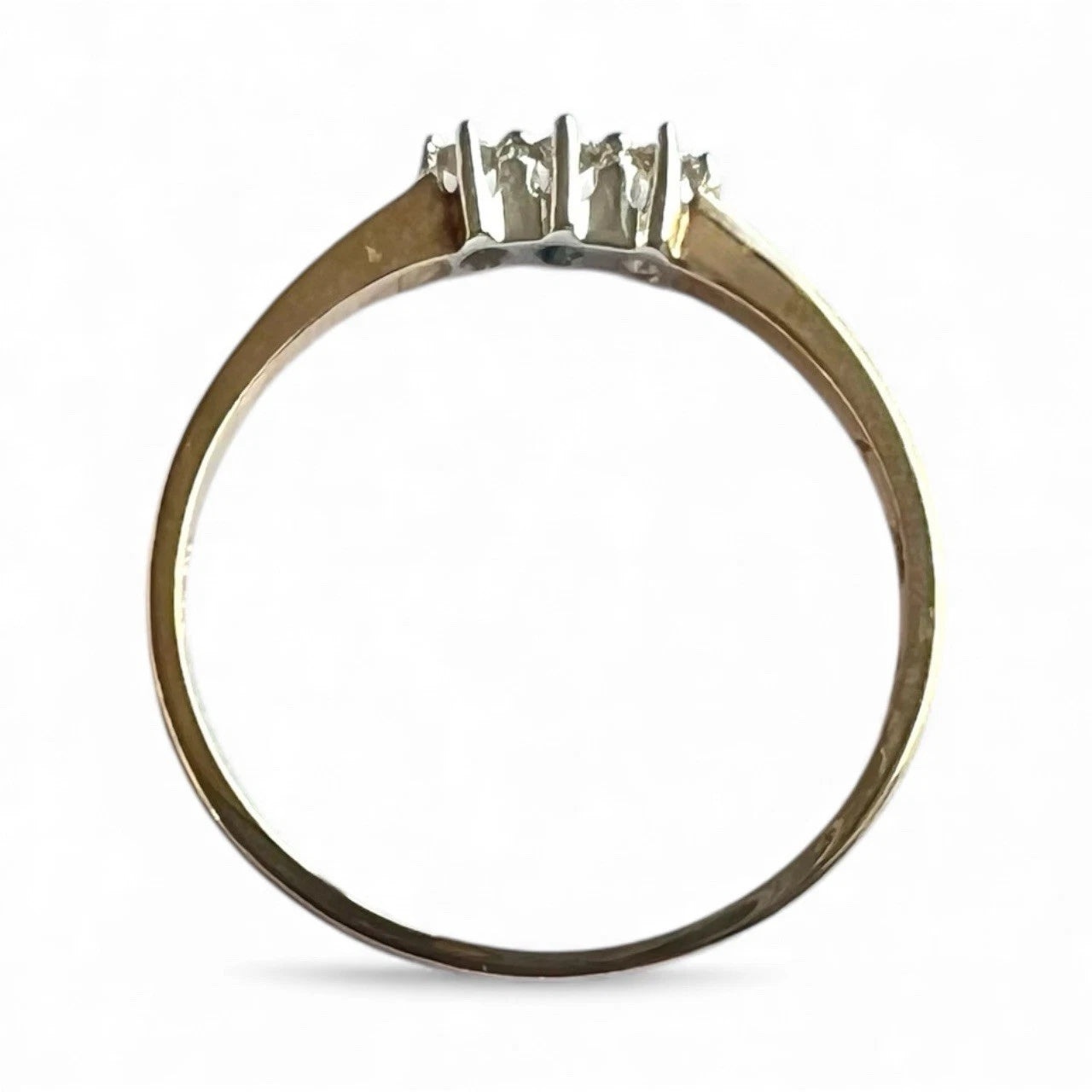Gold ring with three diamonds on a white background