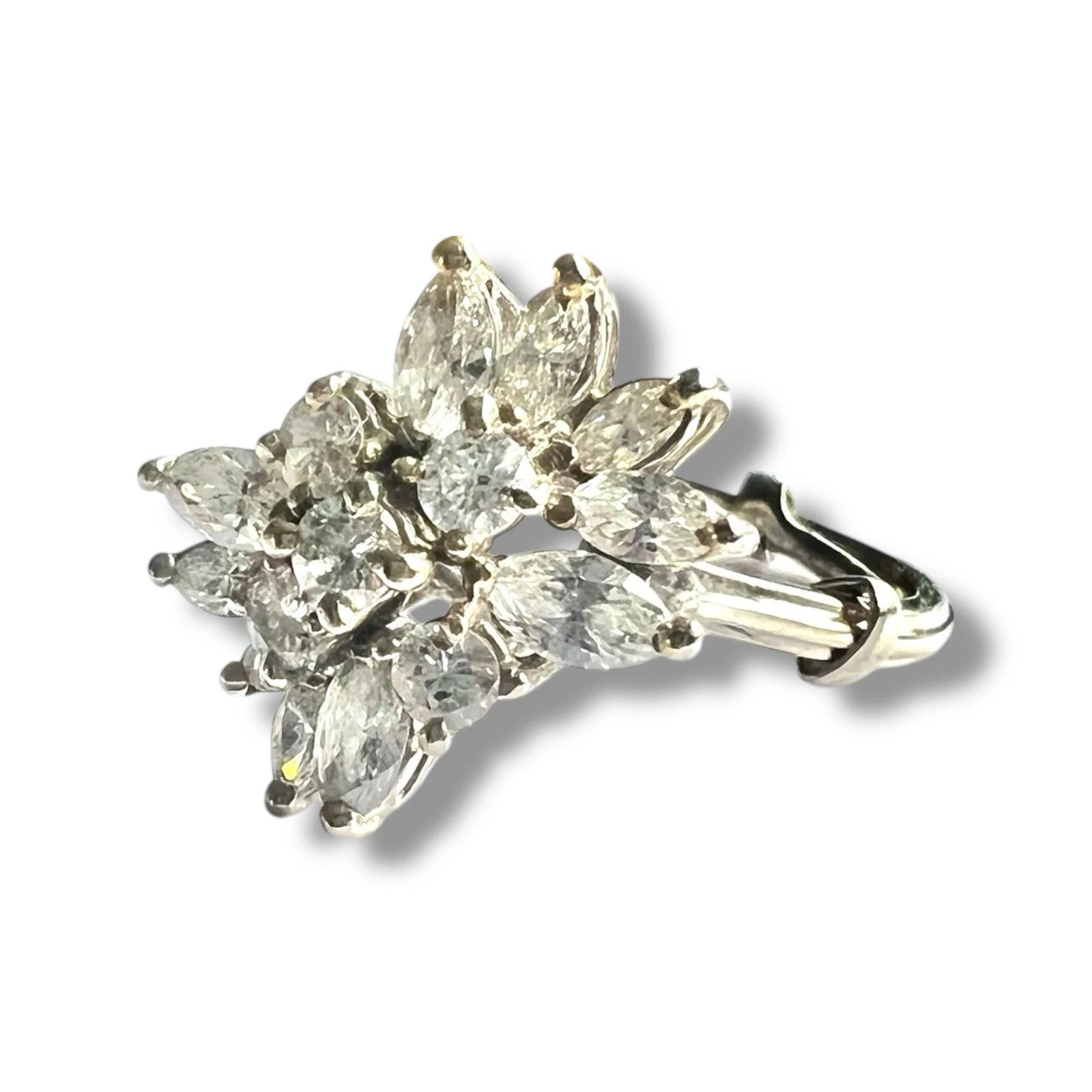 White gold diamond cluster ring on a white background