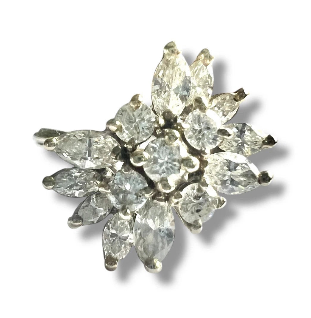 Large Diamond ring with marquise-shaped diamonds on a white background. Close up front view 