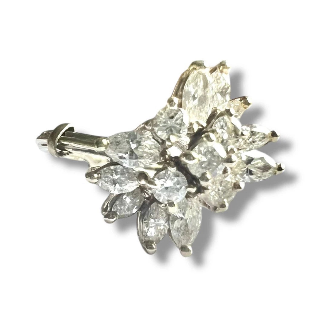 Large diamond close ring with marquise cut diamonds on a white background
