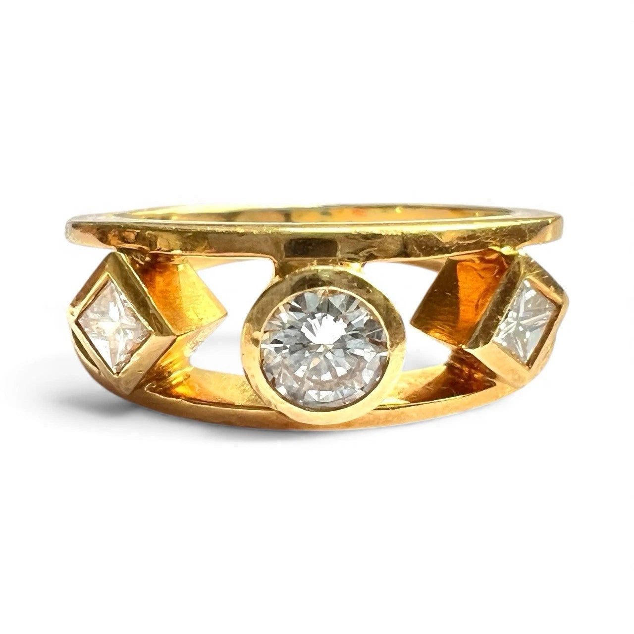 Gold ring with three diamond on a white background. Close up front view 