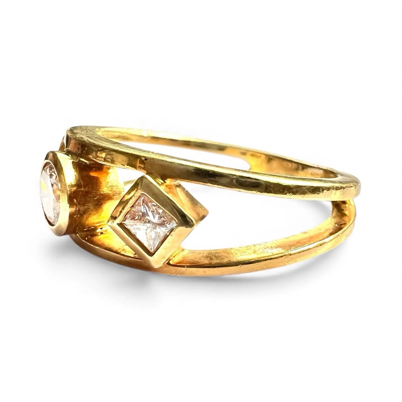 Gold ring with diamonds on a white background