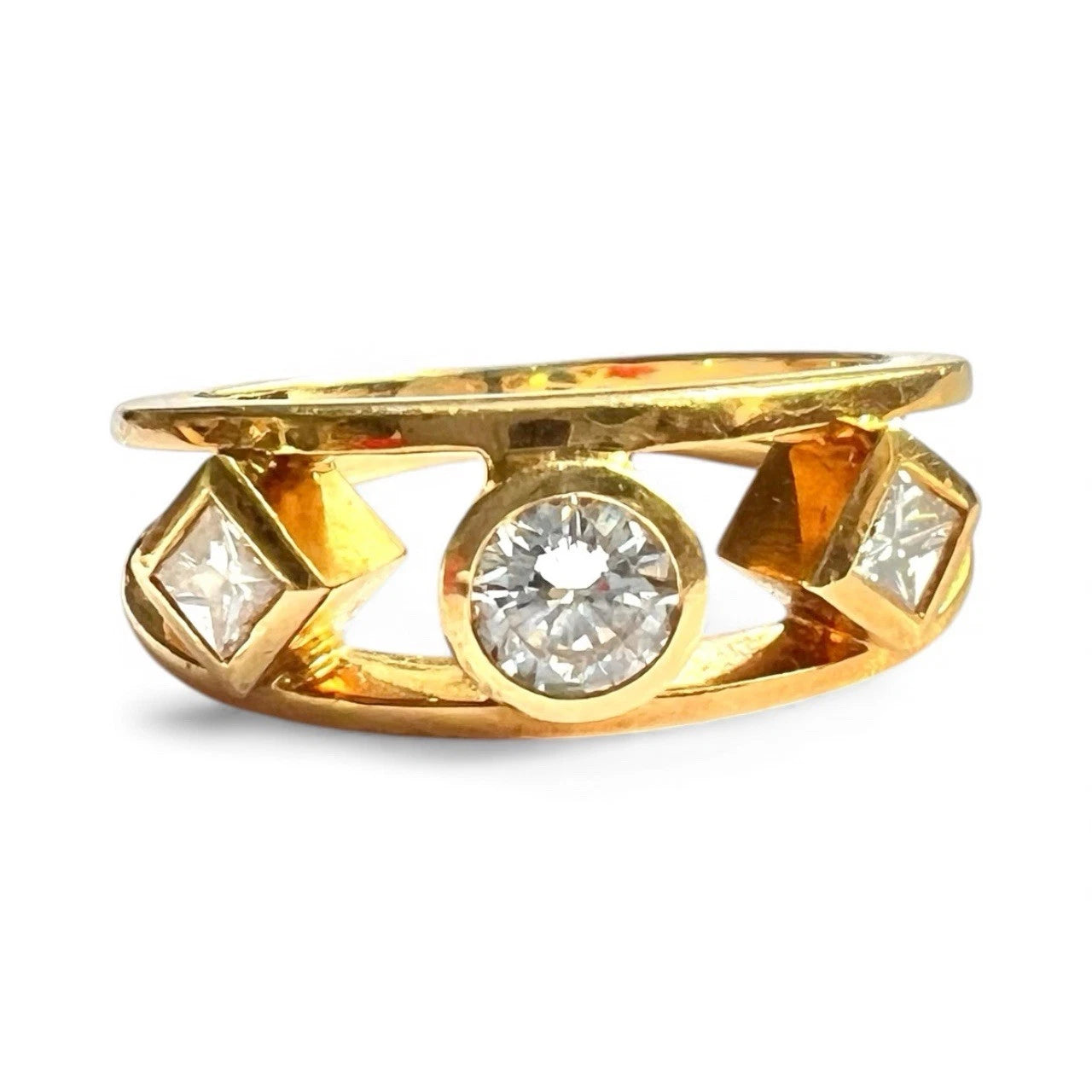 Gold ring with diamonds on a white background