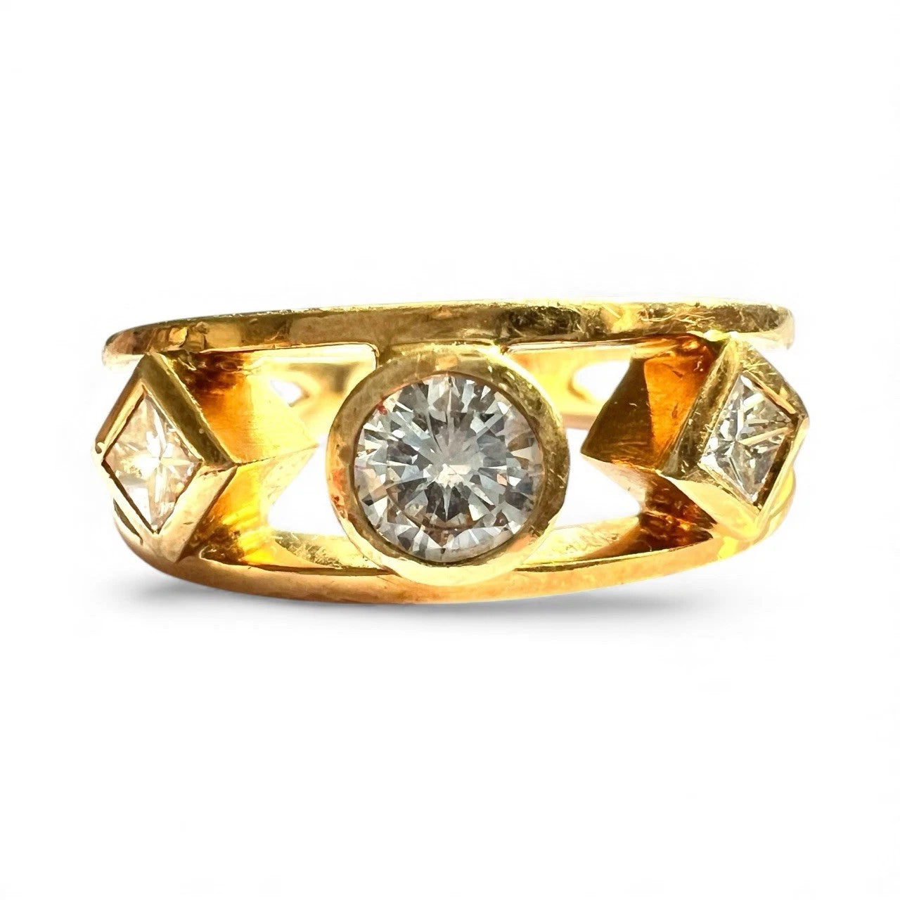 Gold ring with diamonds on a white background. Close up front view 