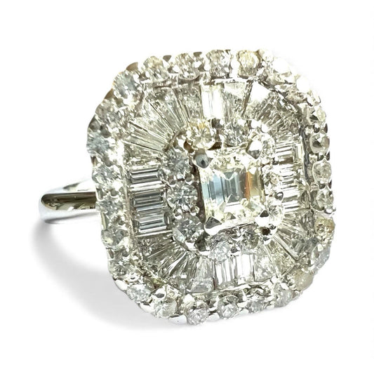 Diamond ring with a central gemstone and smaller stones on a white background