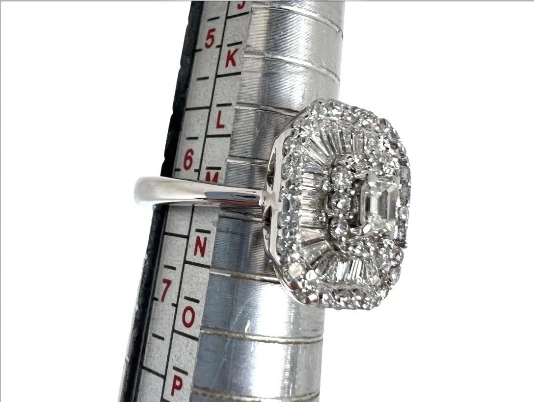 Diamond ring on a ruler for size measurement against a white background