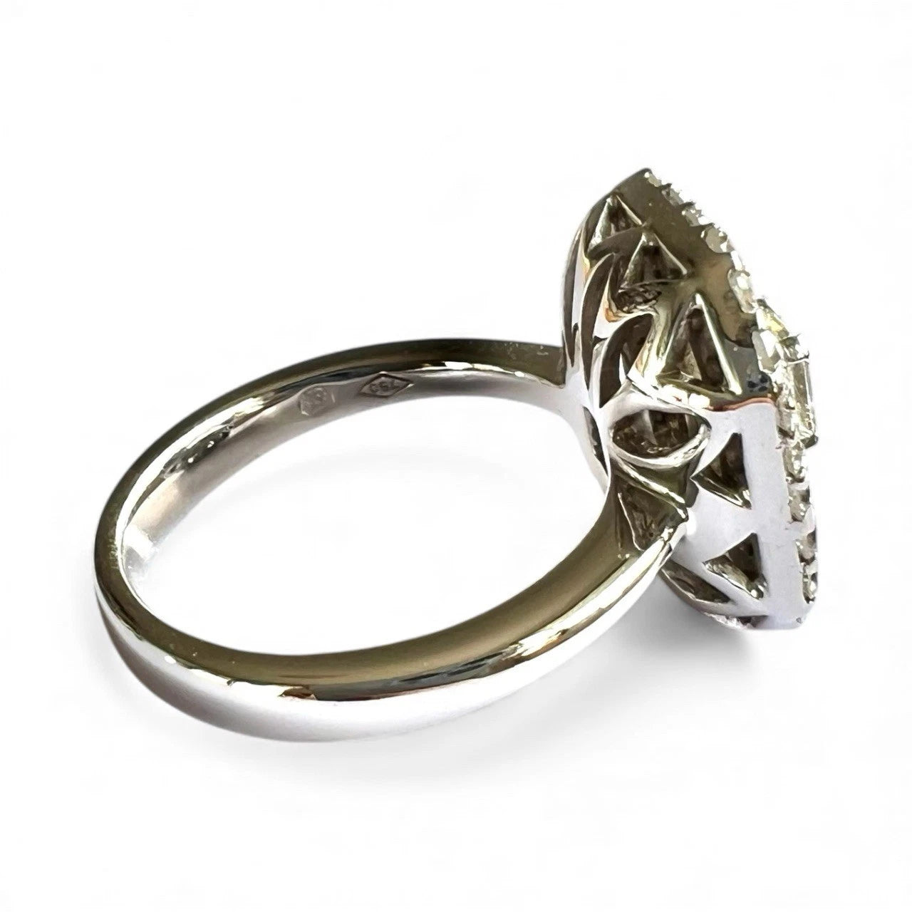 White Gold ring with intricate design on a white background