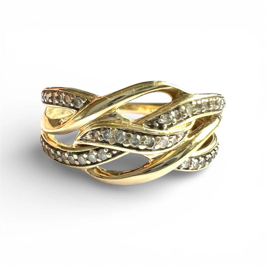 Gold ring with diamond accents on a white background