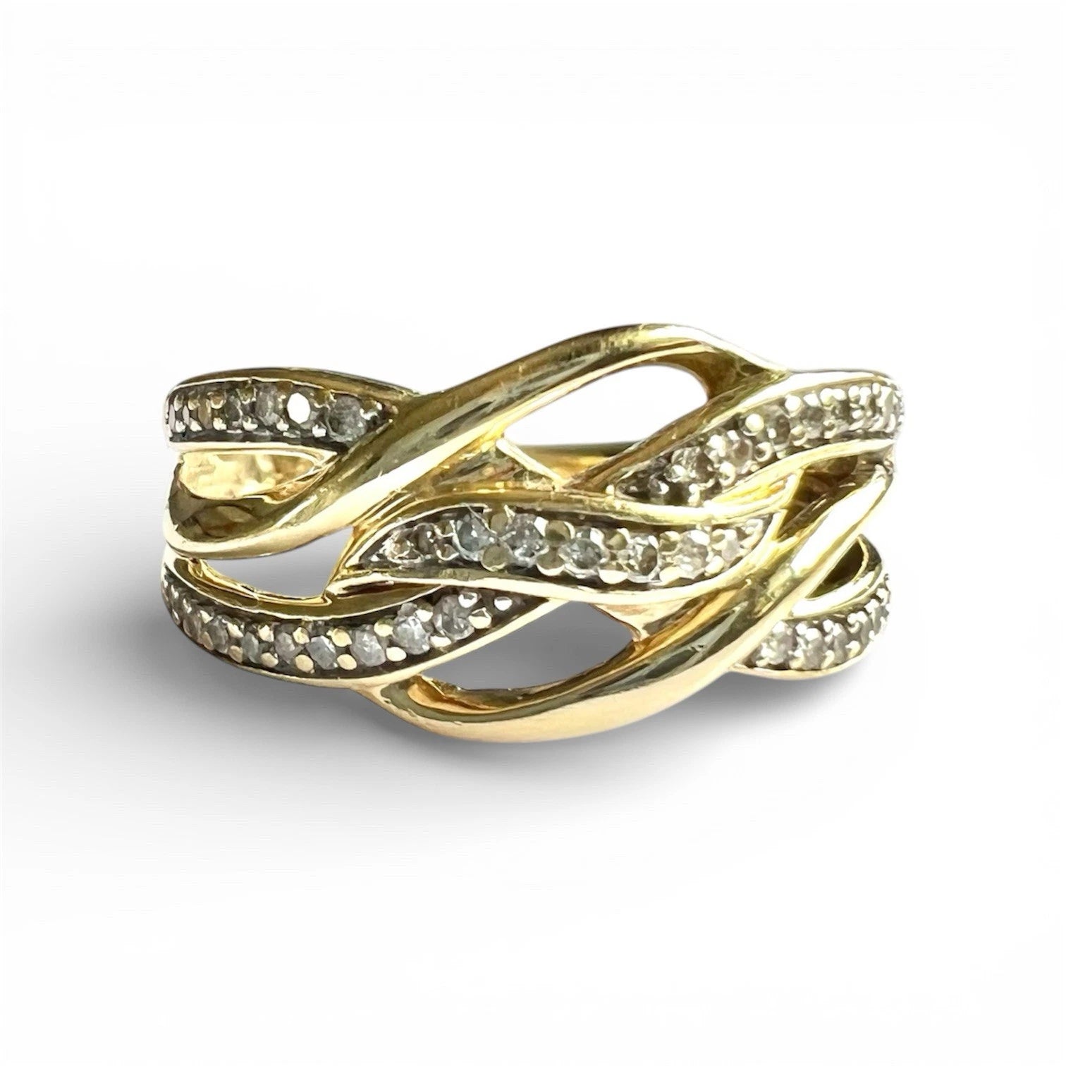 Close up gold ring with diamond accents on a white background