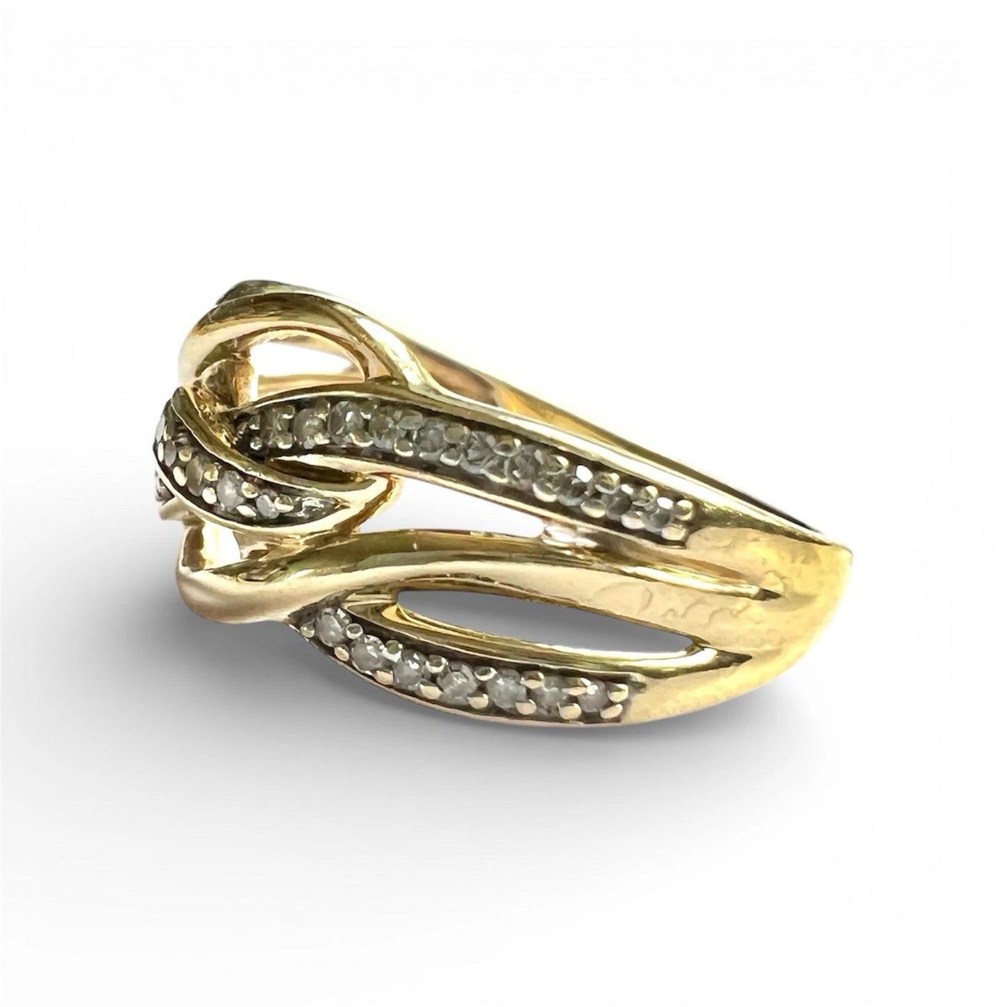 Gold ring with diamond accents on a white background