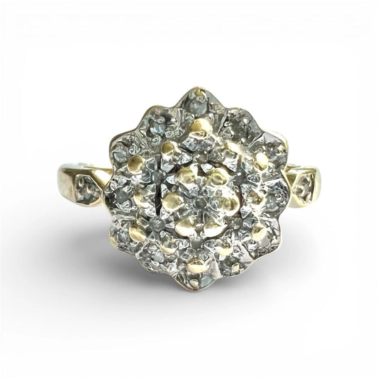 Gold Diamond cluster ring with a white background. Close up front view 