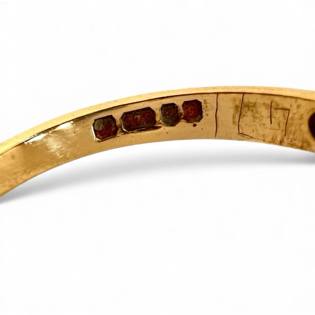Gold ring hallmark on a white background