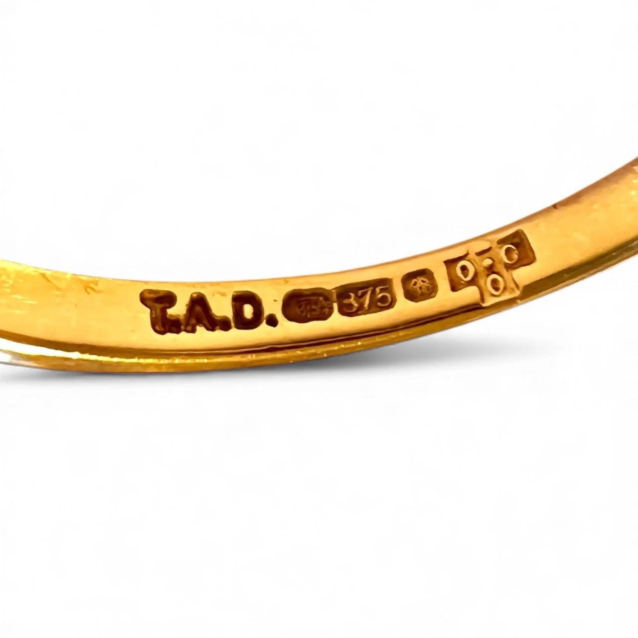 Gold Ring with visible hallmark on a white background