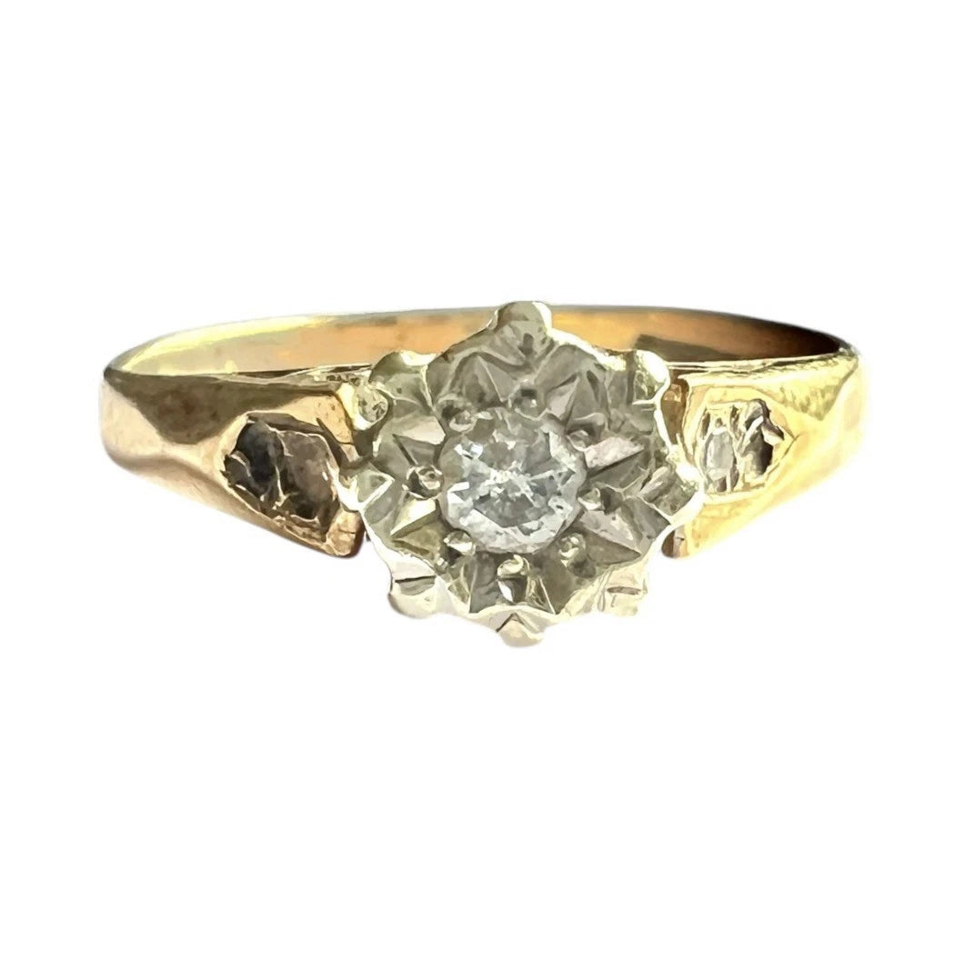 Vintage Gold ring with a diamond on a white background, close-up front view of setting 