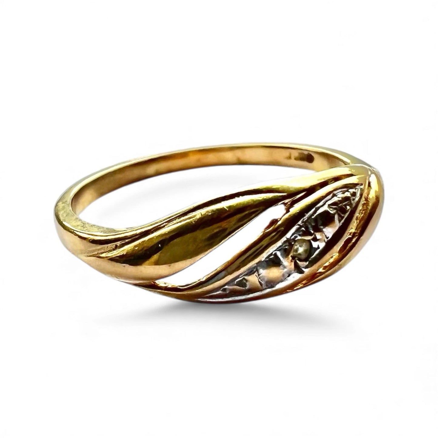 Close up gold ring with a diamond on a white background