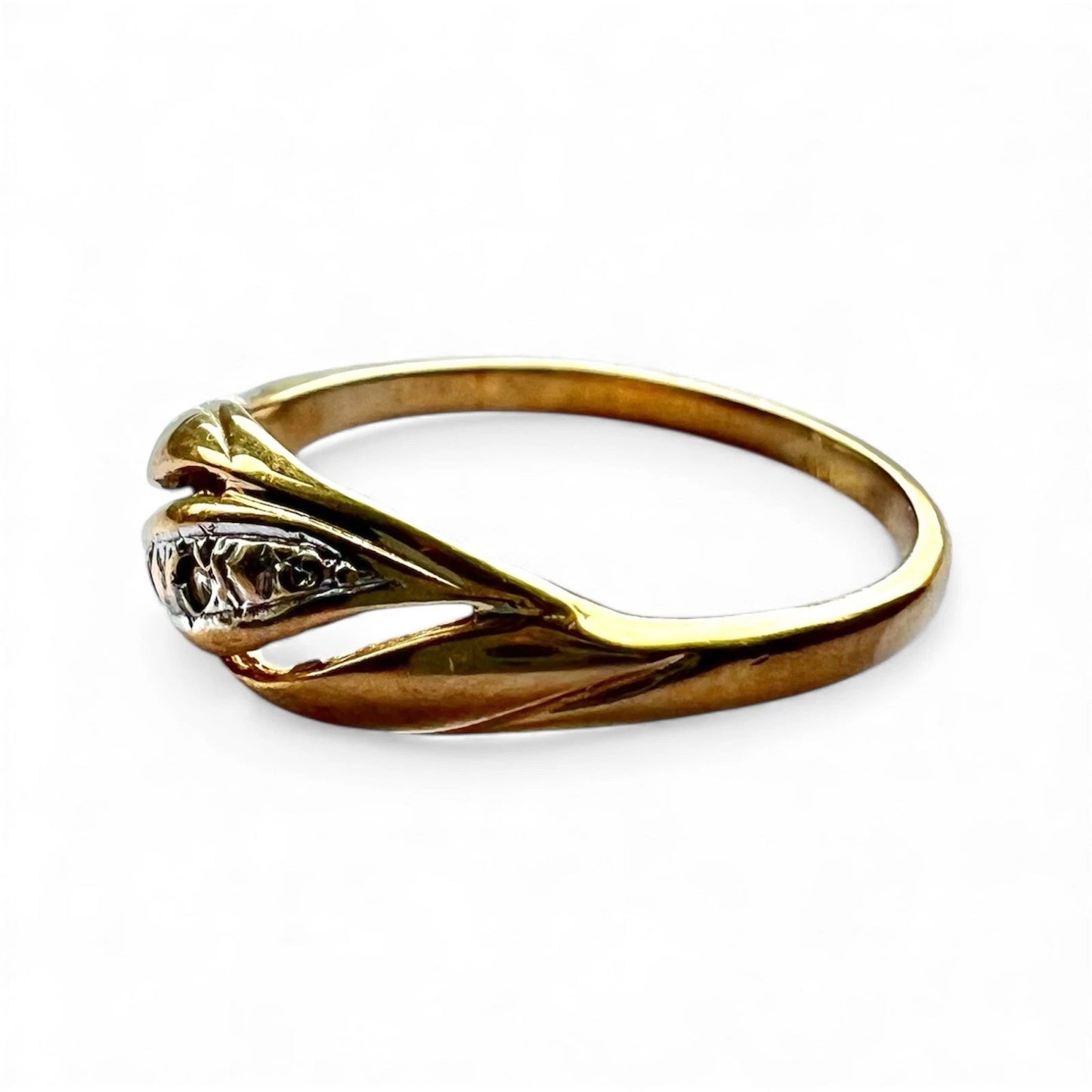 Gold ring with a diamond side view on a white background
