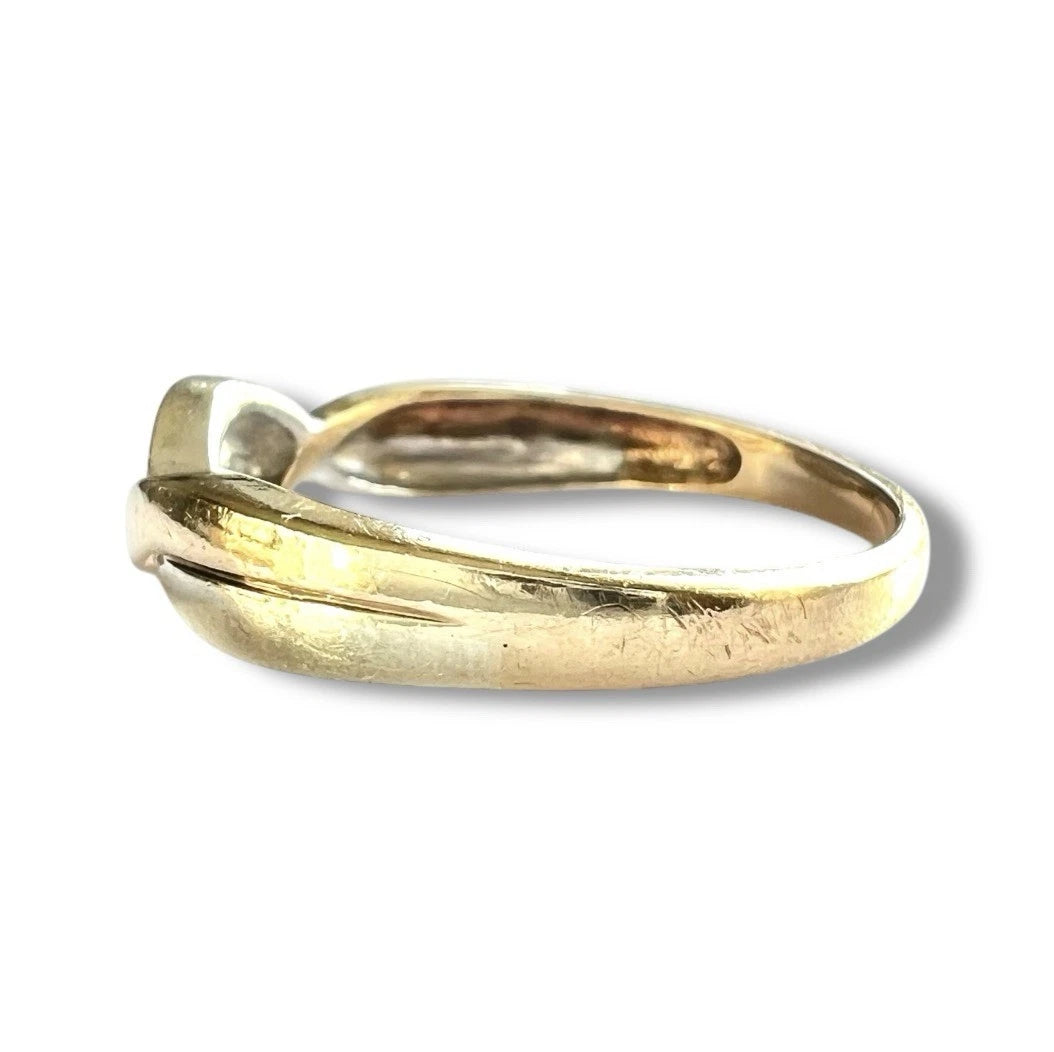 Gold diamond ring on a white background. Close up side view. 
