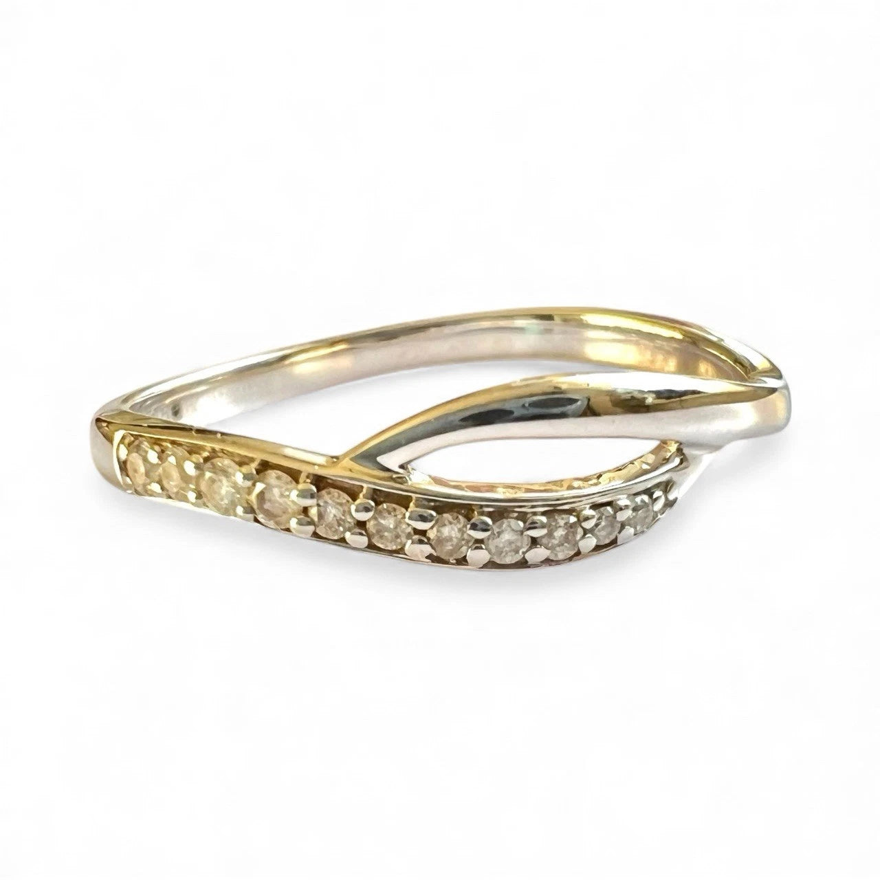 White Gold ring with small diamonds on a white background close up front view 