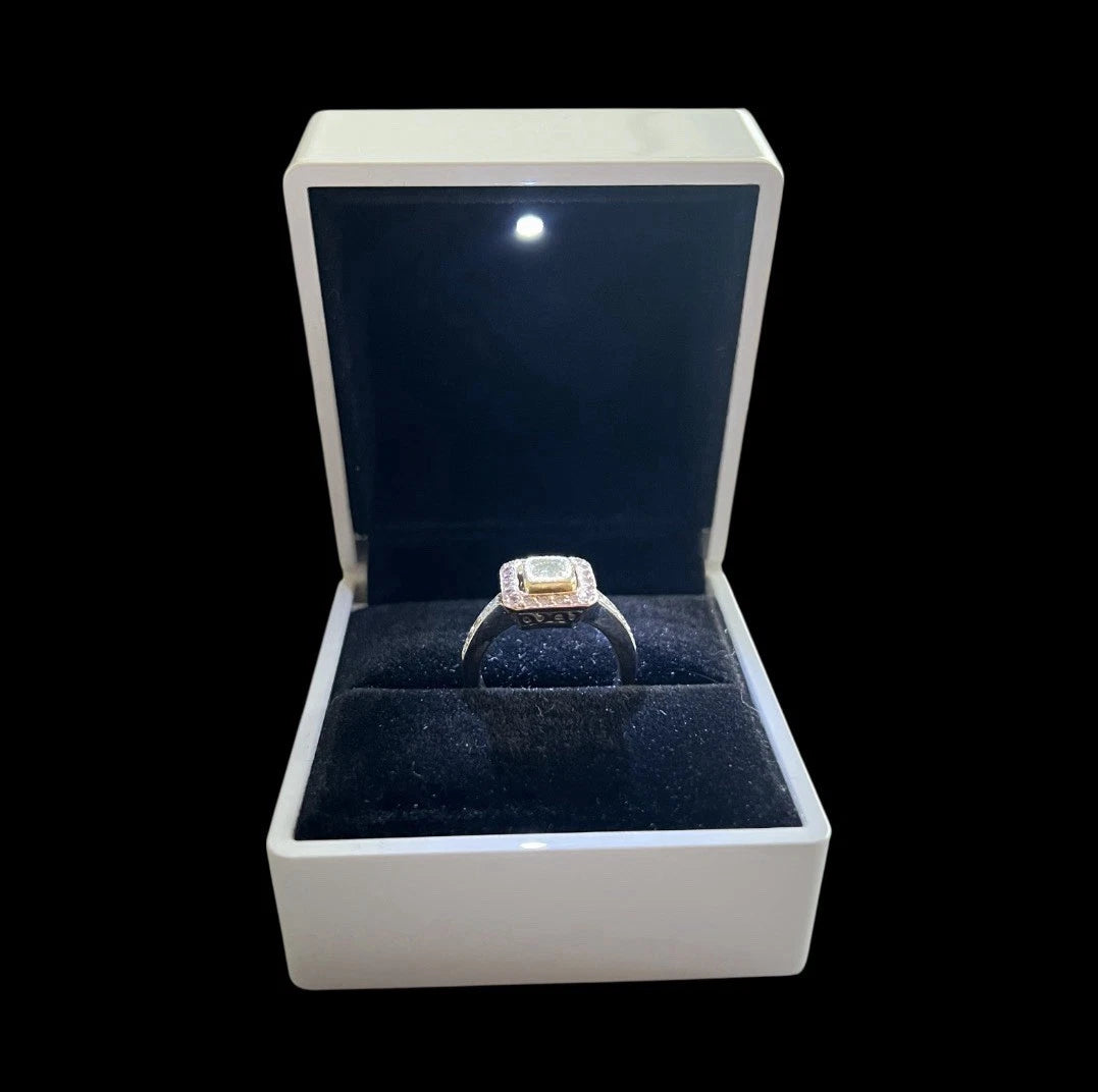 Yellow Diamond ring in a white box with a black interior