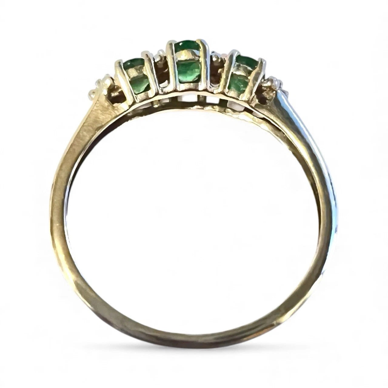 Gold diopside ring top down view on white background 