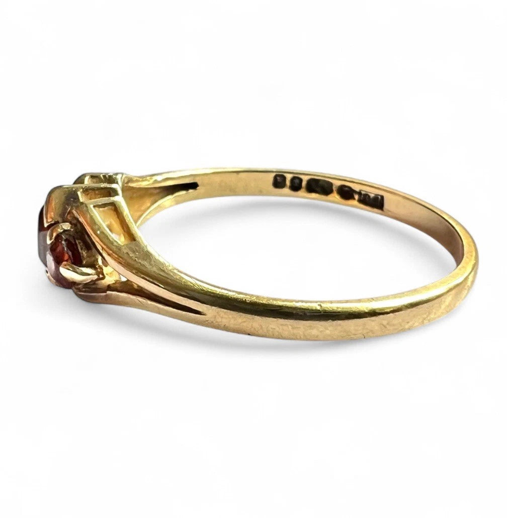 Gold ring with a gemstone on a white background