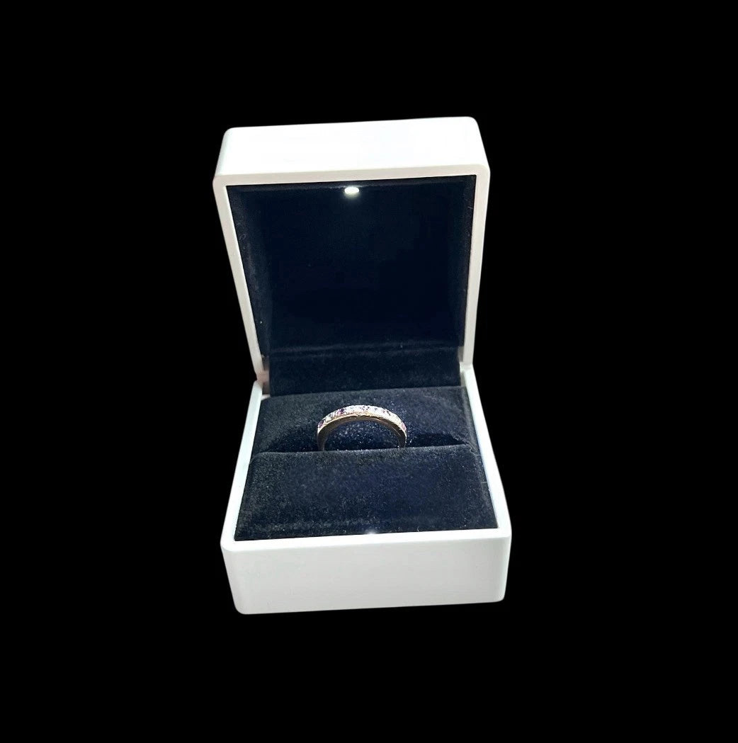 Vintage gold Ruby ring in a white box with a black interior