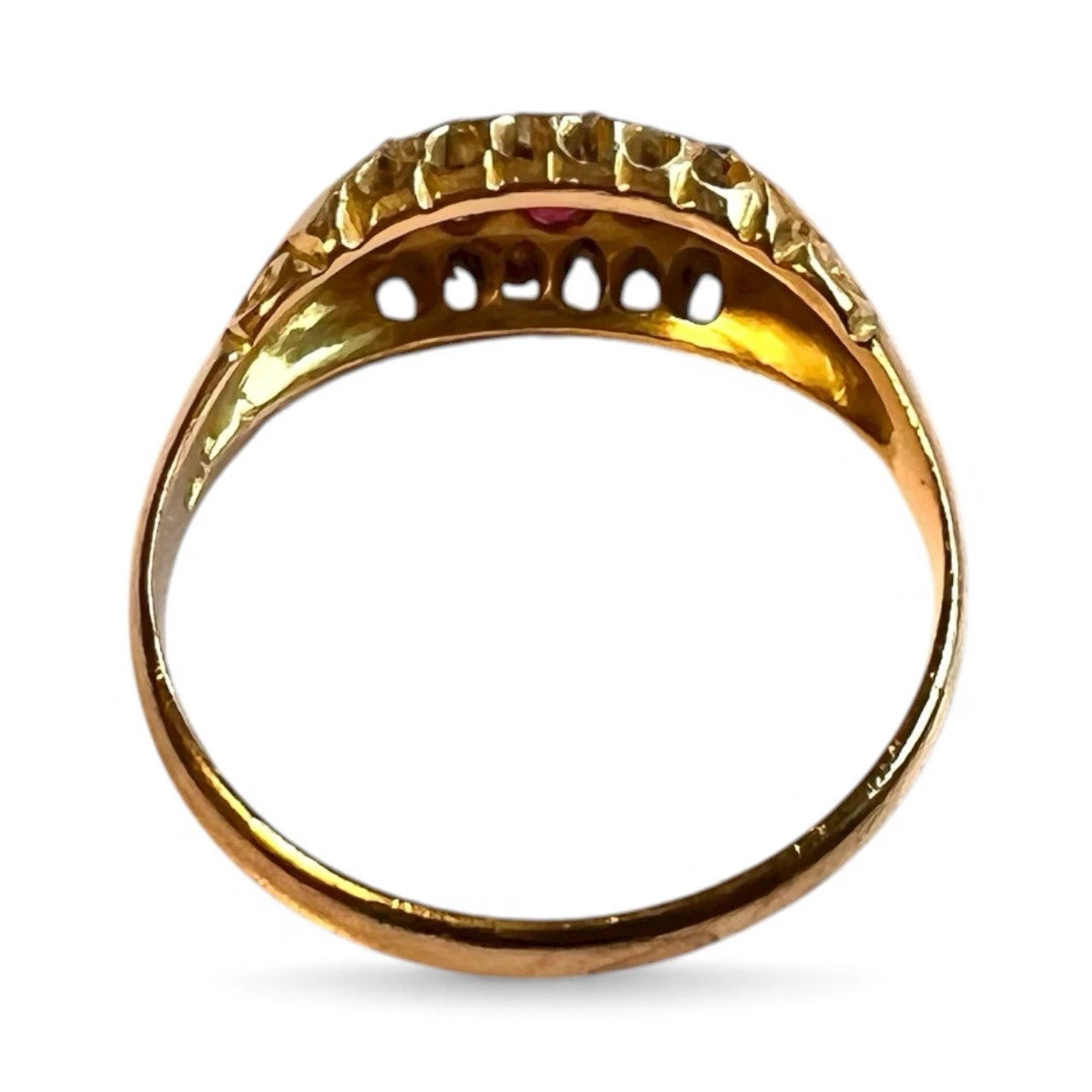 Gold ring with a textured band on a white background
