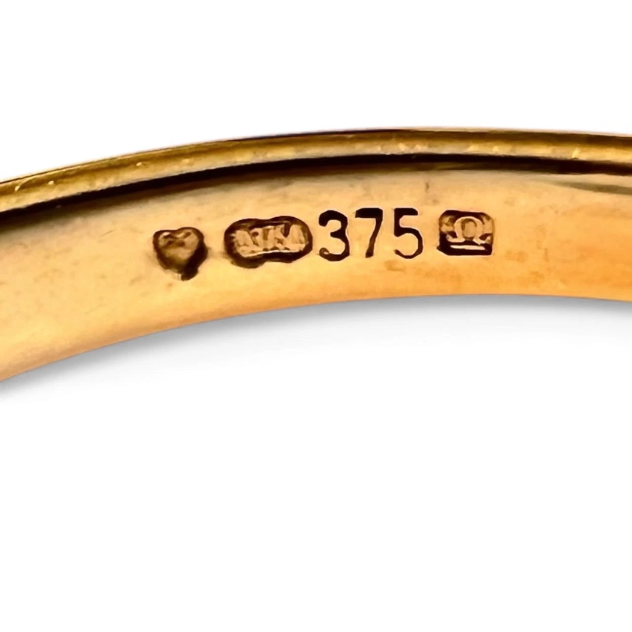 Gold ring with '375' hallmark on a white background