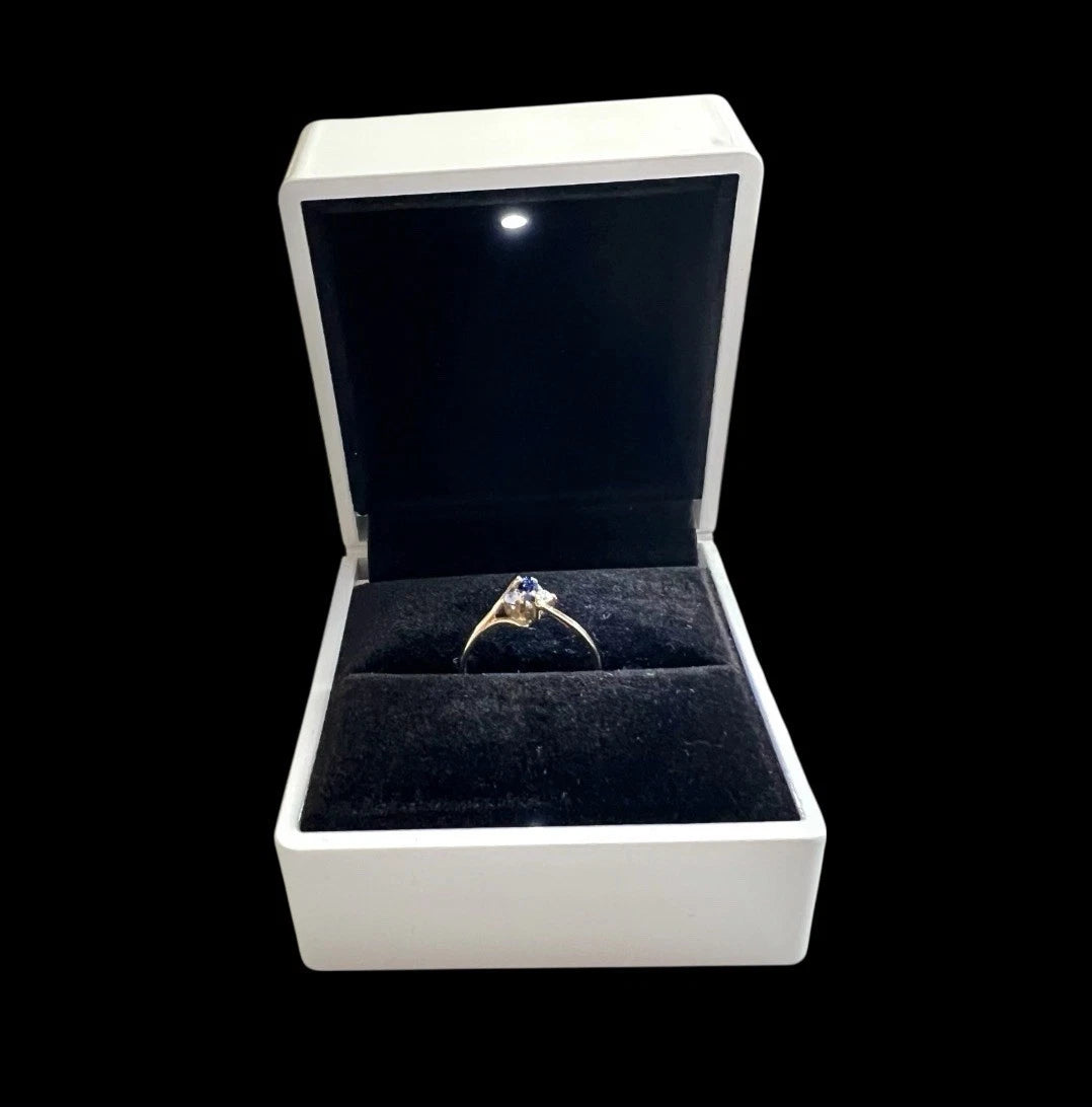 Jewellery box with a ring inside on a white background