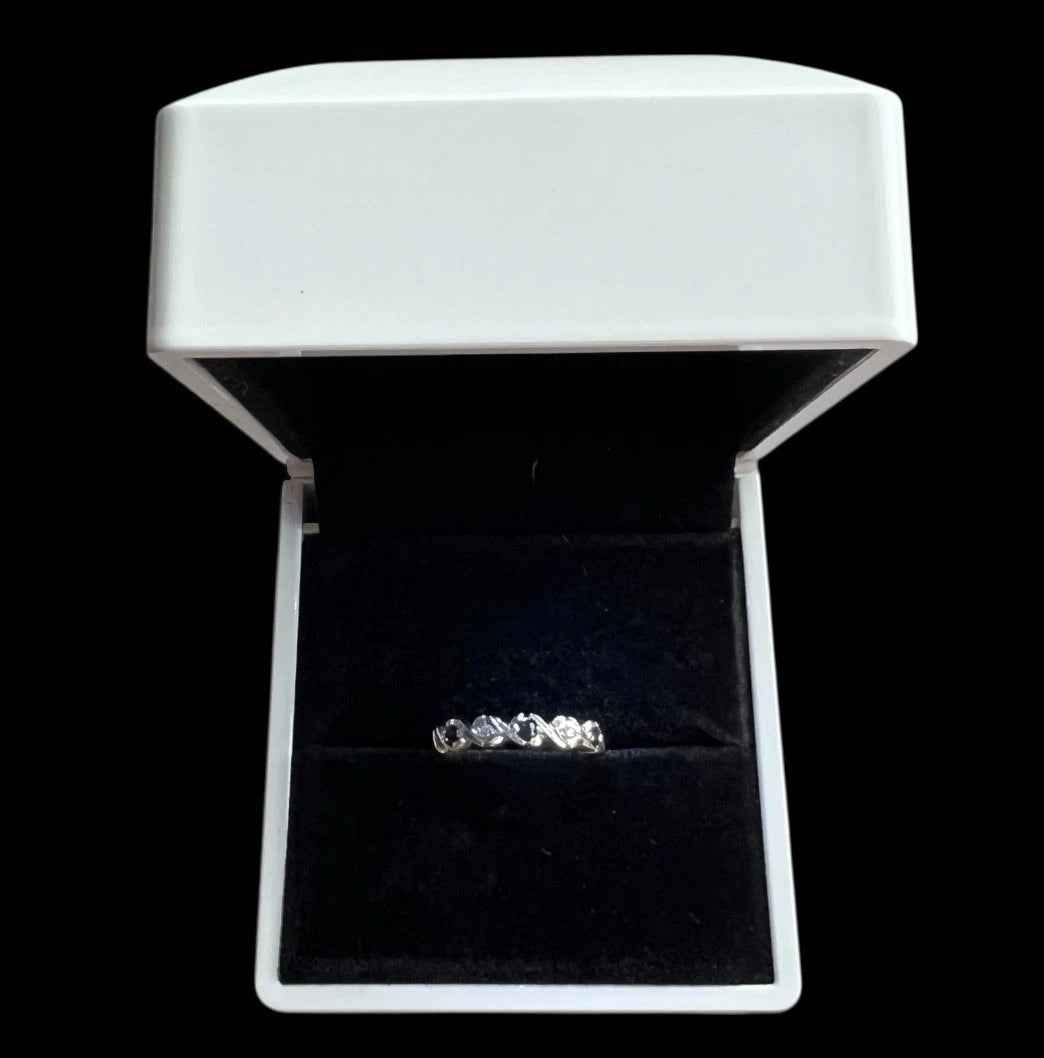 Sapphire and Diamond ring in a white jewellery box with a black interior