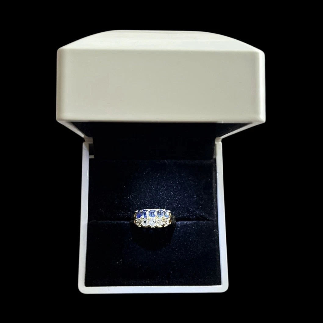 Antique Diamond and sapphire ring in a jewellery box on a black background
